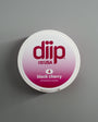 diip black cherry 4 nicotine-free dip pouch can laying on a white background