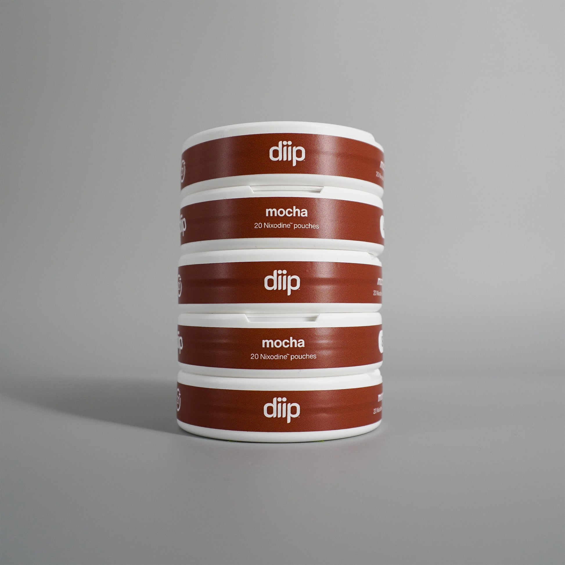 diip mocha 4 nicotine-free dip pouch cans standing upright in front of a white background