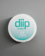 diip tropical 4 nicotine-free dip pouch can laying on  a white background